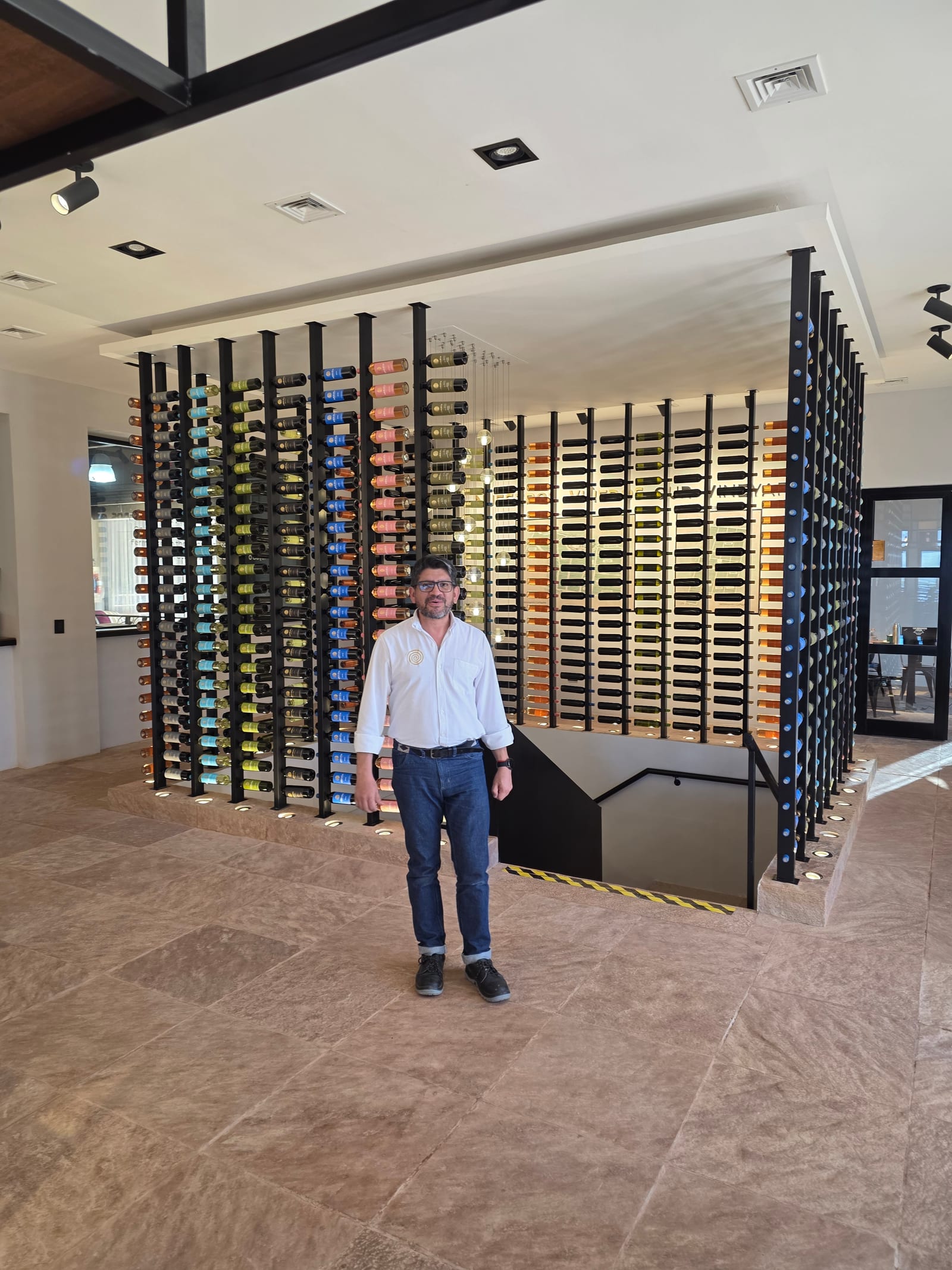 Pedro, manager of Bodega Amalaya, by the wine wall